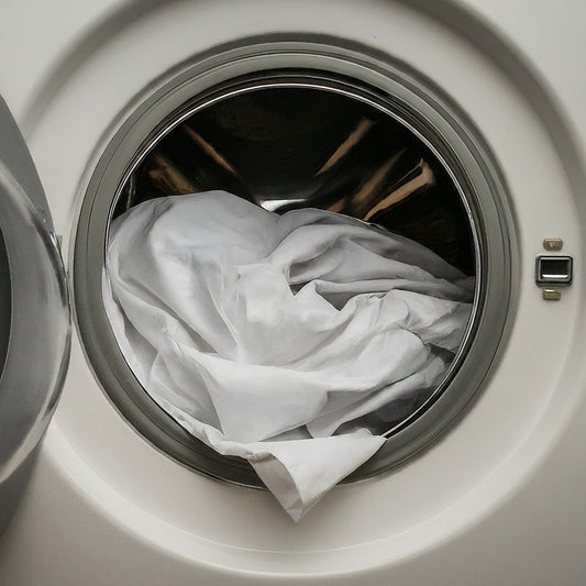 White bed sheet in washing machine