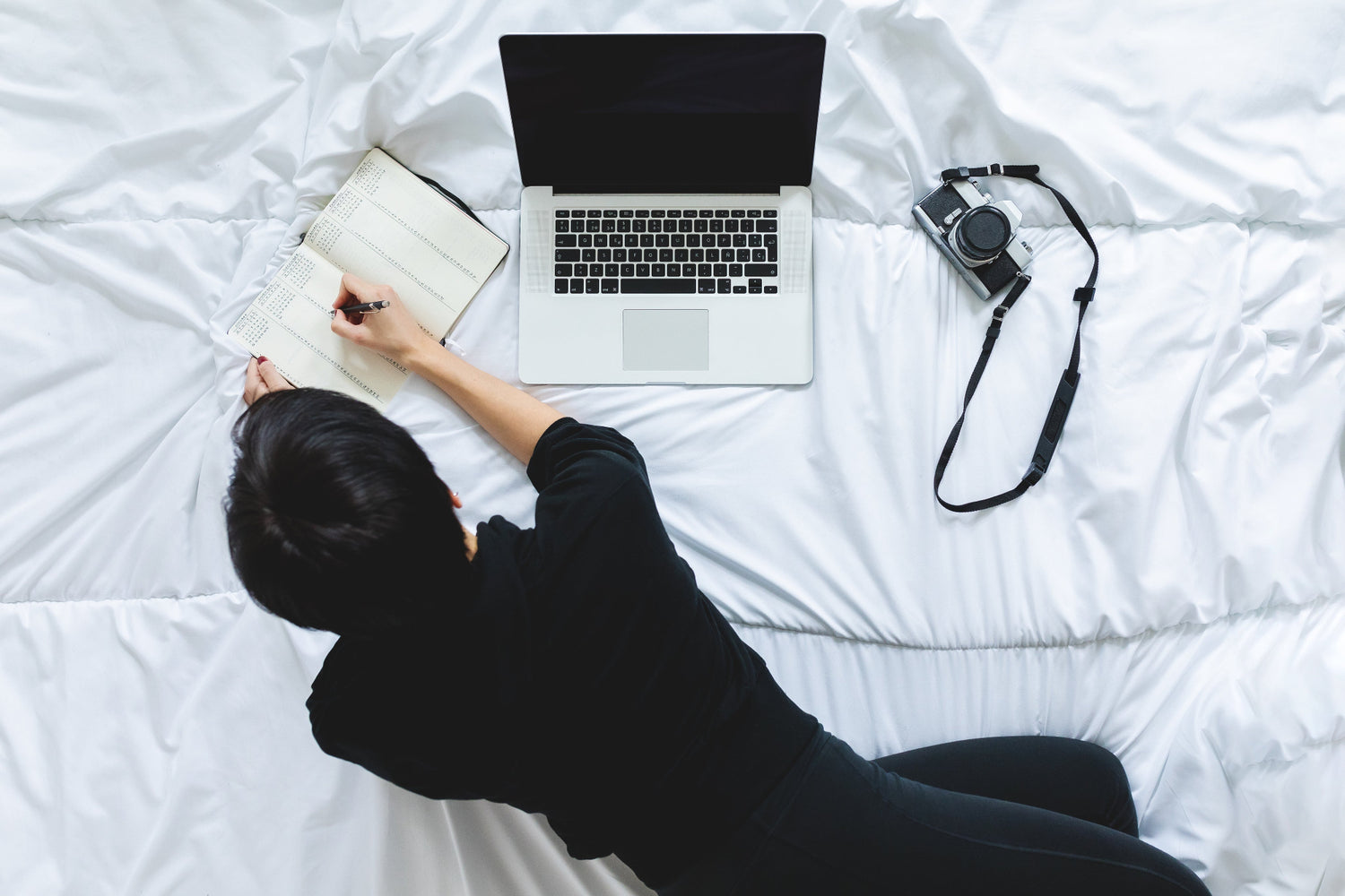 Person working on White Cotton Bedsheet